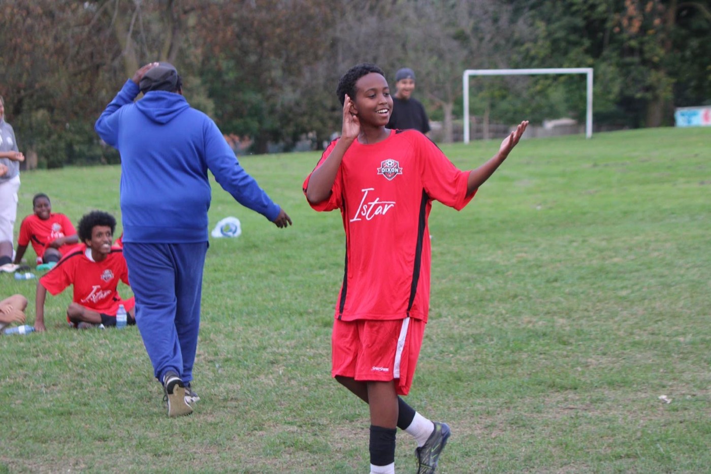A smiling Dixon FC player celebrates