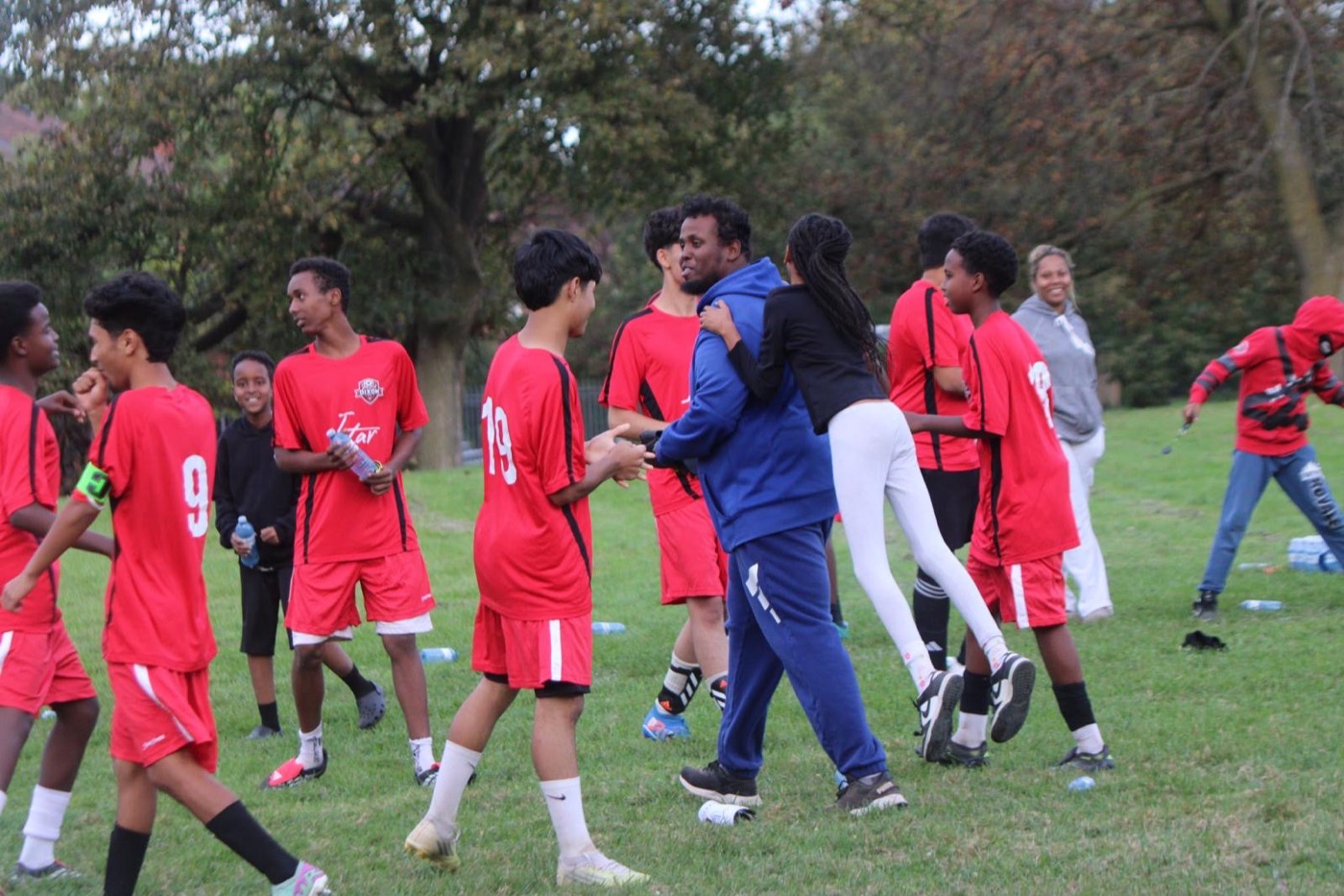 Coaches, players and families celebrate together