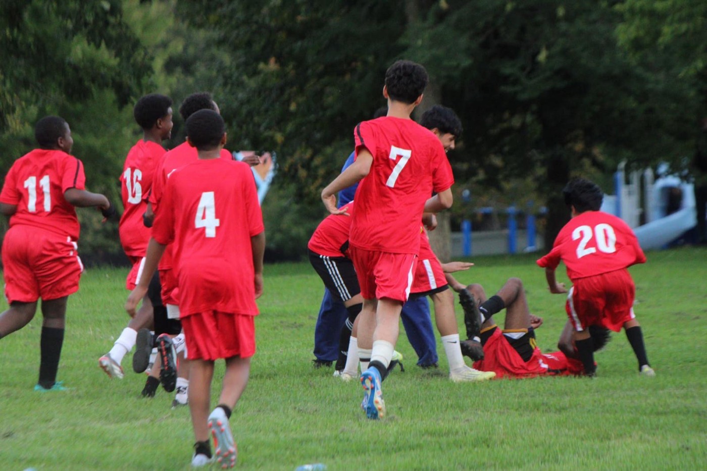 Young players celebrate a goal together