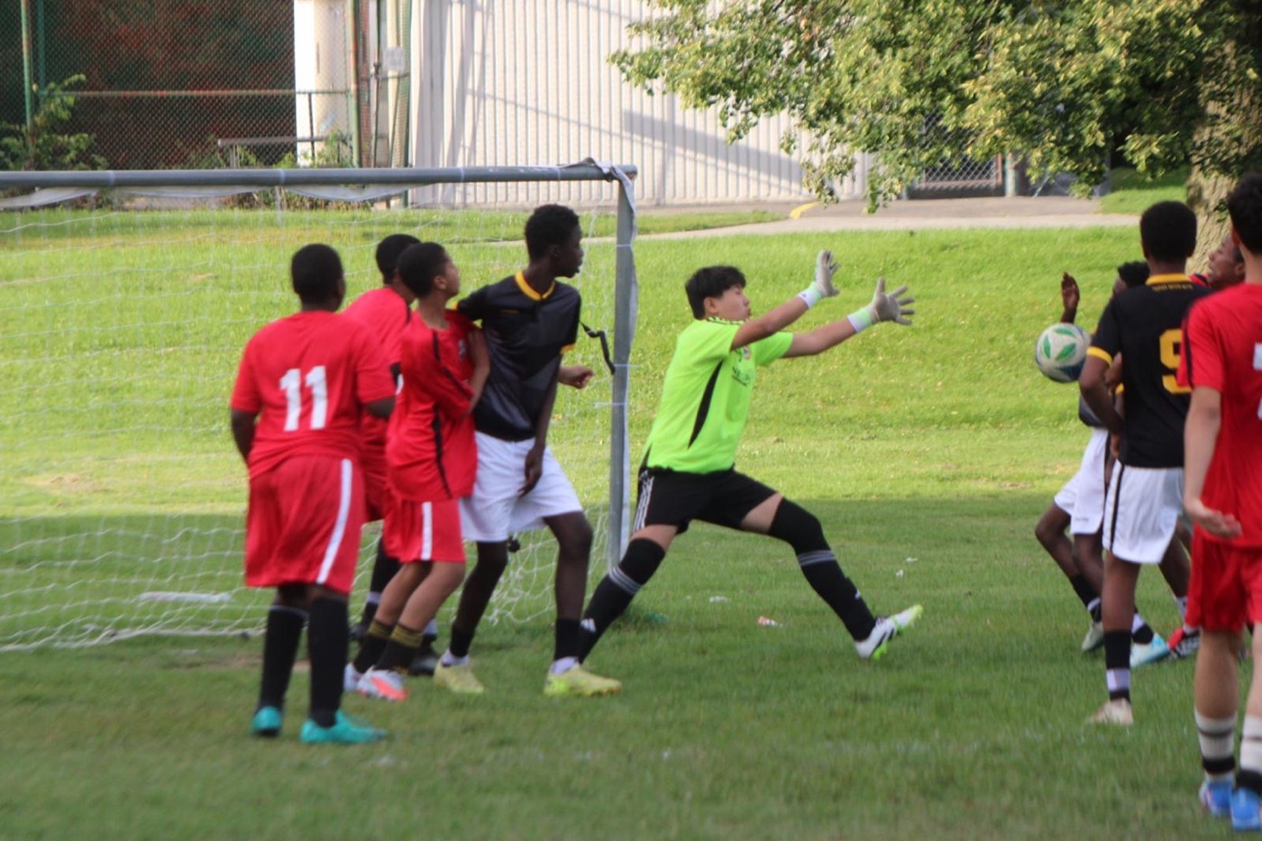 A goalkeeper dives to make a save